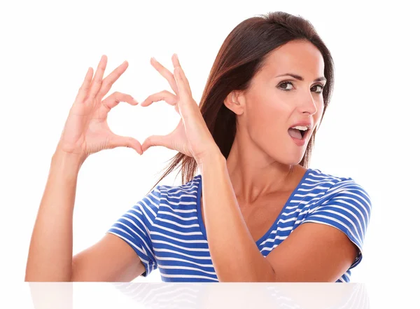 Lady in blue t-shirt with heart sign — Stock Photo, Image