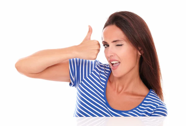 Winking woman in blue t-shirt with thumbs up — Stock Photo, Image