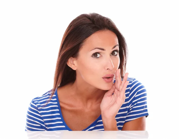 Lovely girl in blue t-shirt whispering a secret — Stock Photo, Image