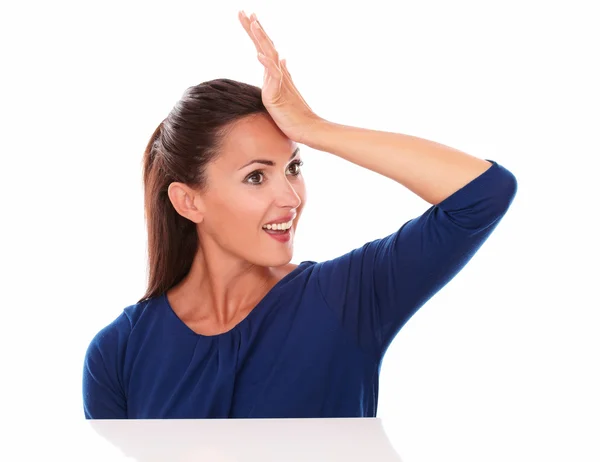 Woman with hand on forehead looking surprised — Stock Photo, Image