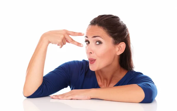 Cheerful young lady making a victory sign — Stock Photo, Image