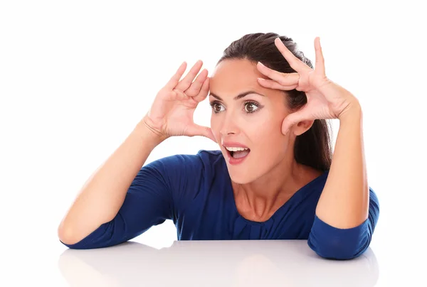 Lady in blue blouse looking surprised — Stock Photo, Image