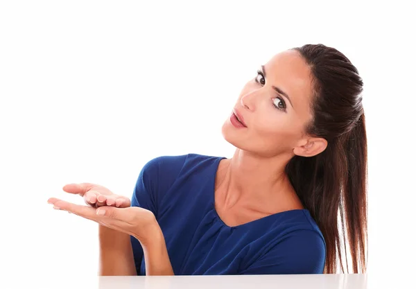 Lovely woman in blue shirt holding palms up — Stock Photo, Image