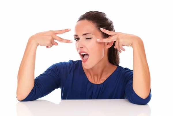 Beautiful winking woman making two victory sign — Stock Photo, Image