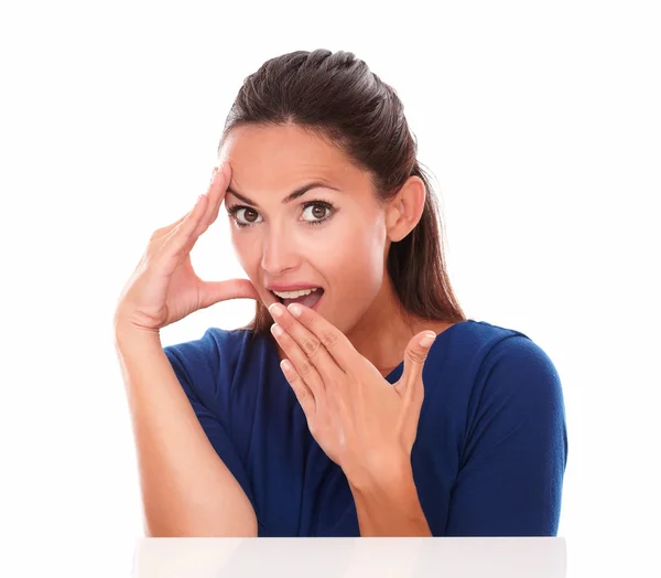 Young hispanic in blue blouse looking surprised — Stock Photo, Image