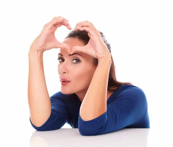 Pretty lady making a love sign — Stock Photo, Image