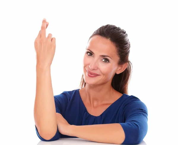 Friendly latin smiling and crossing fingers — Stock Photo, Image