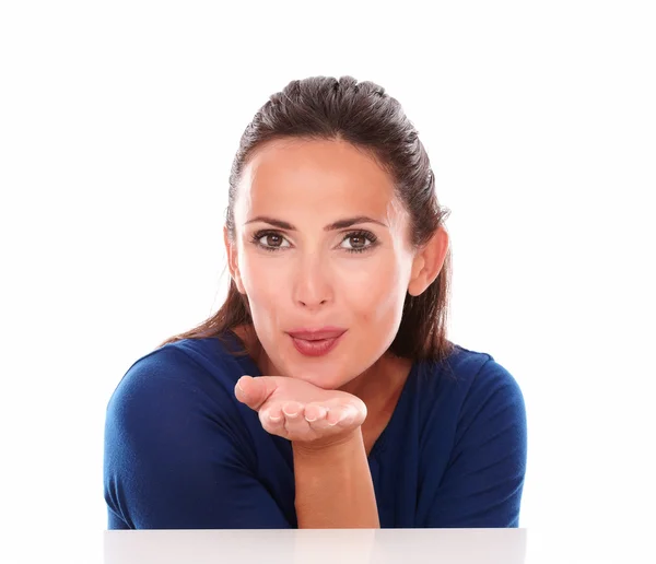 Attractive woman with palms up blowing a wish — Stock Photo, Image