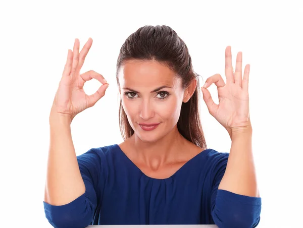 Lovely girl smiling and making an ok sign — Stock Photo, Image