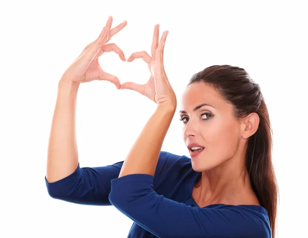 Charming woman making a love sign — Stock Photo, Image