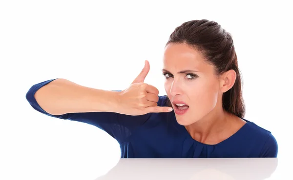 Angry pretty female gesturing a call — Stock Photo, Image