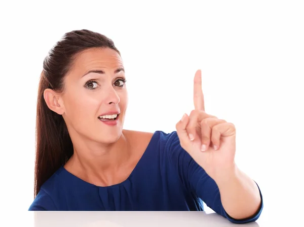 Lovely female with finger pointing up — Stock Photo, Image