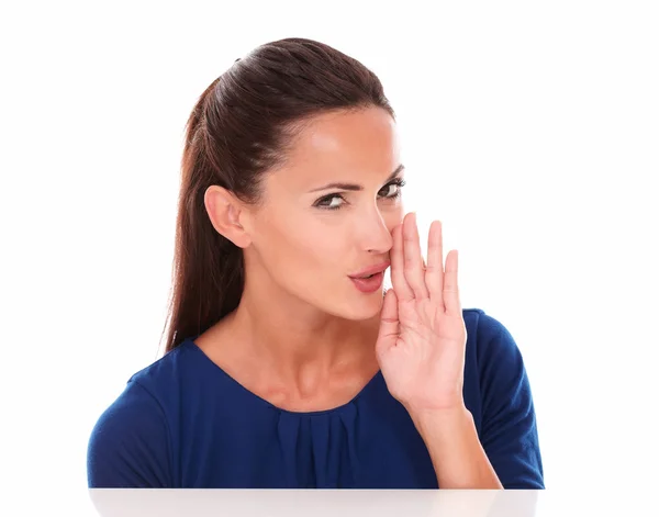 Cute hispanic woman in blue shirt whispering — Stock Photo, Image