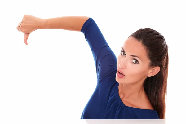 Attractive girl in blue shirt with thumb down — Stock Photo, Image