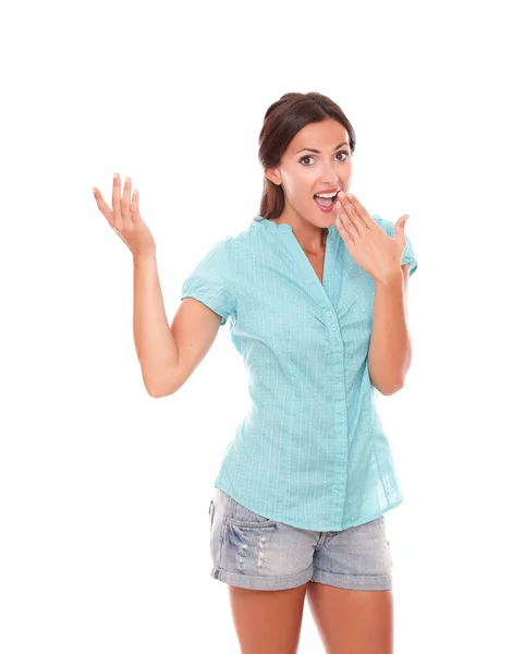 Lady in short jeans with hand on mouth — Stock Photo, Image