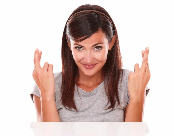Cheerful lady crossing her fingers while smiling — Stock Photo, Image