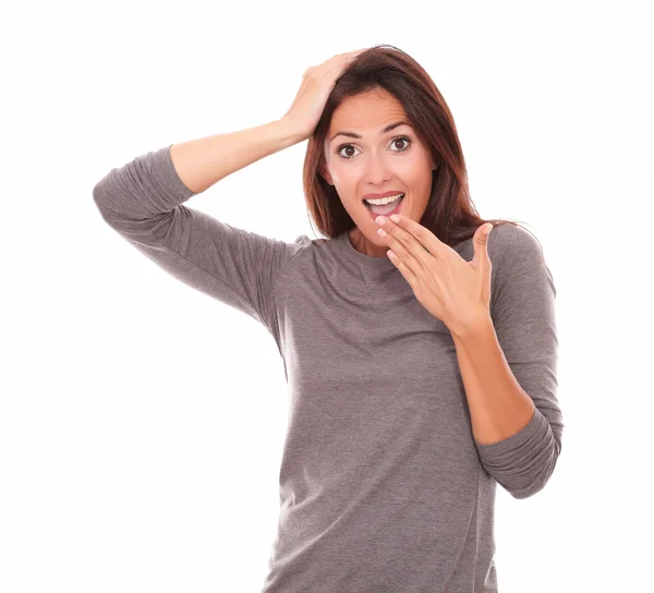 Surprised woman holding mouth and looking at you — Stock Photo, Image