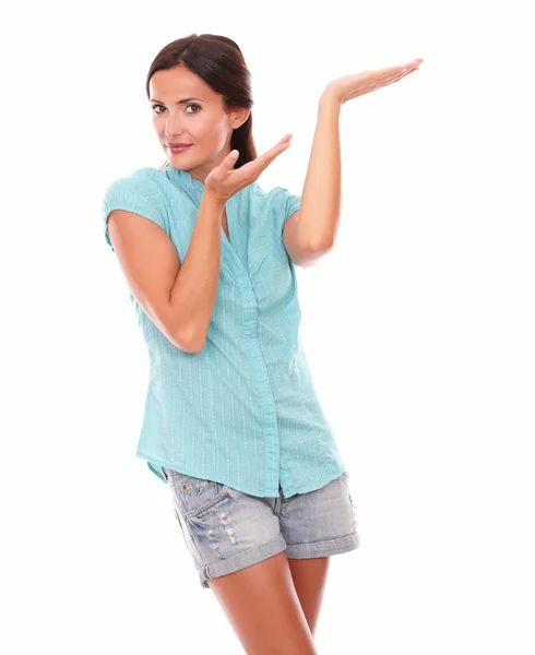 Young hispanic lady holding palm up — Stock Photo, Image