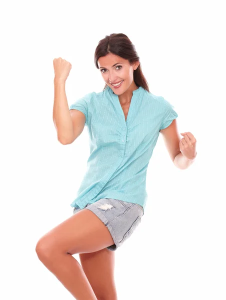 Young hispanic lady in blue shirt with arm up — Stock Photo, Image