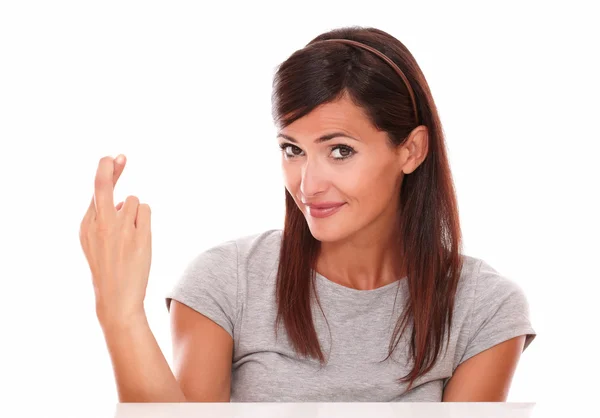 Attractive young girl crossing her fingers — Stock Photo, Image