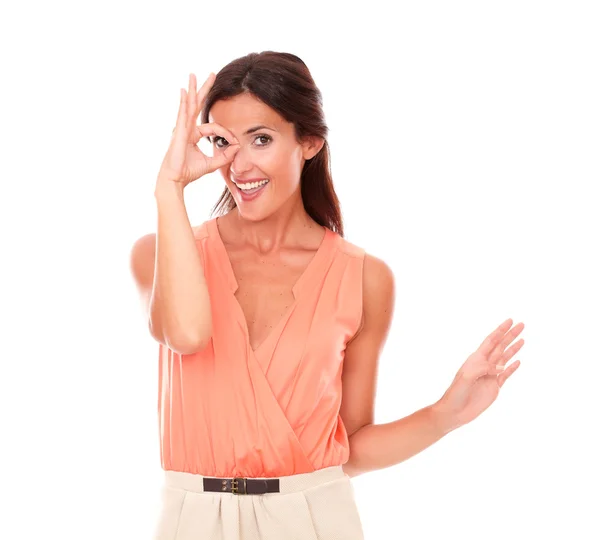 Smart young female looking through monocular — Stock Photo, Image