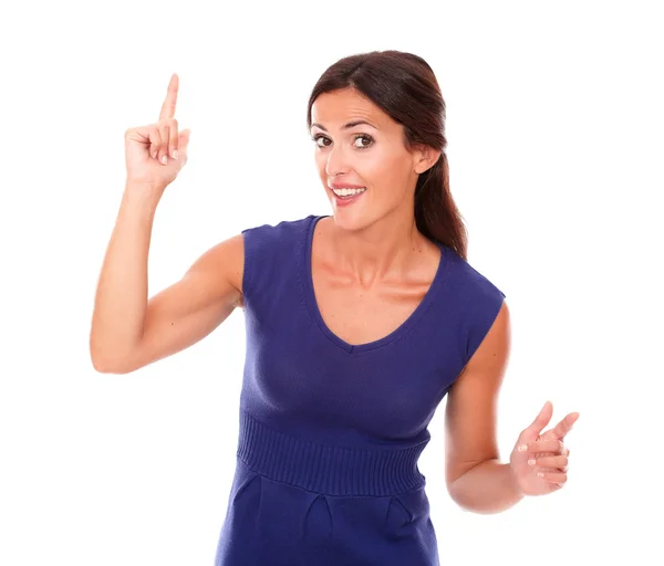 Beautiful girl with finger pointing up — Stock Photo, Image