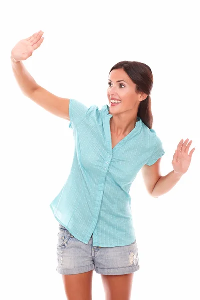 Friendly young female gesturing a greeting — Stock Photo, Image