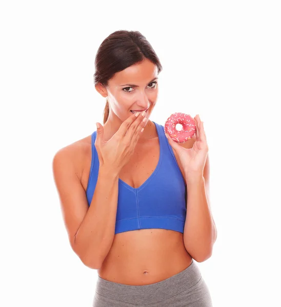 Slim adult female holding donut on left hand — Stock Photo, Image