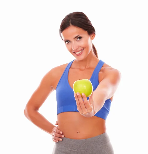Lady in sportswear holding apple on left hand Royalty Free Stock Images