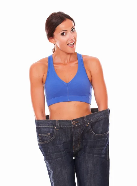 Lady in training clothes measuring body shape — Stock Photo, Image
