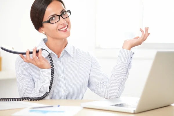 Pretty professional employee speaking on the phone — Stock Photo, Image