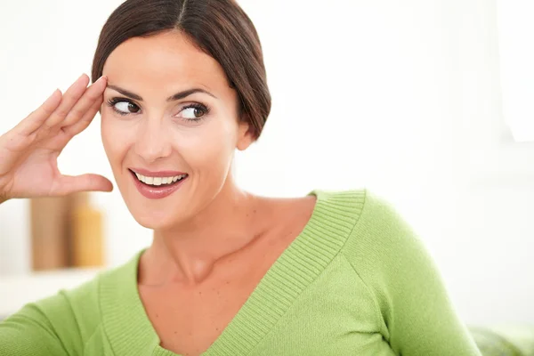 Woman with toothy smile looking away — Stock Photo, Image