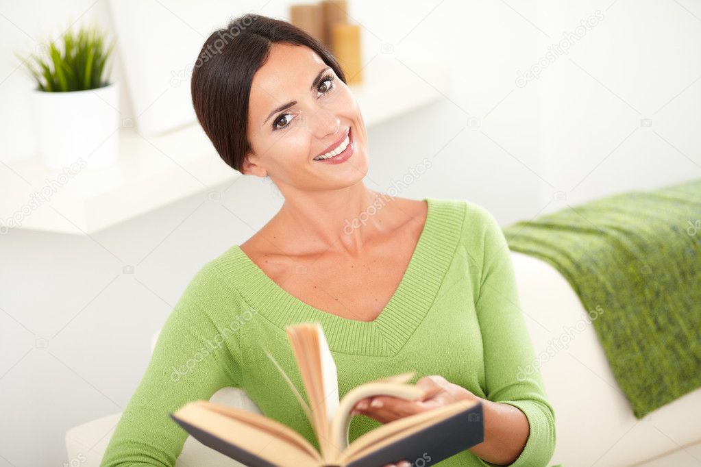 Beautiful caucasian woman browsing a book