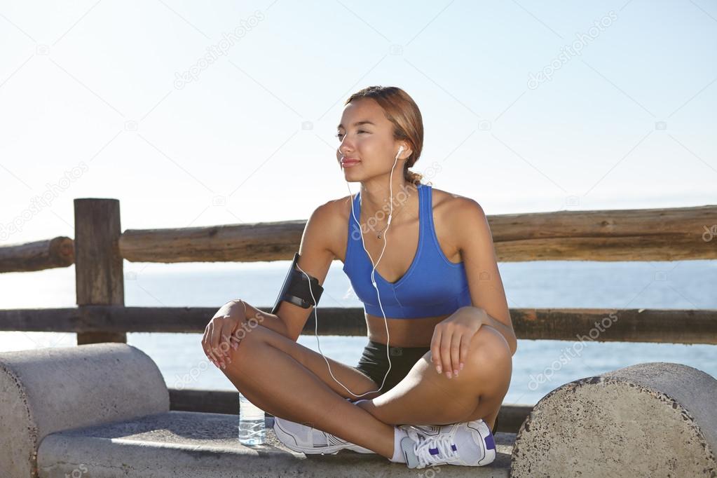 woman resting on the coastline