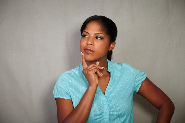 Pensive woman looking away while thinking — Stock Photo, Image