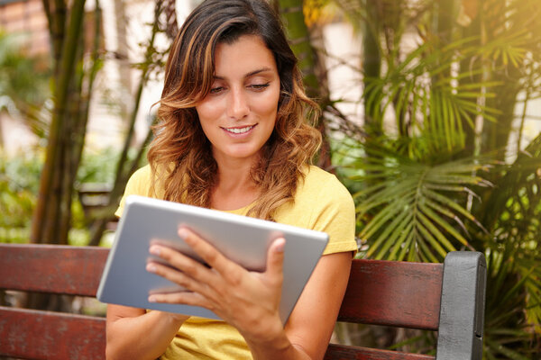 woman browsing internet on tablet