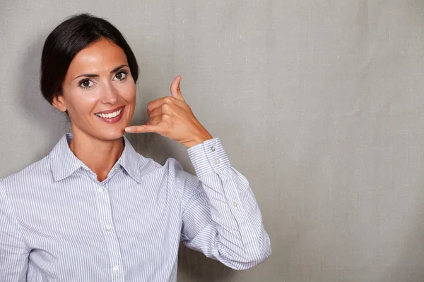 Female with phone call gesture — Stok fotoğraf