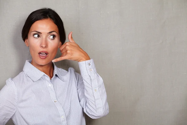 Surprised female gesturing call — Stok fotoğraf