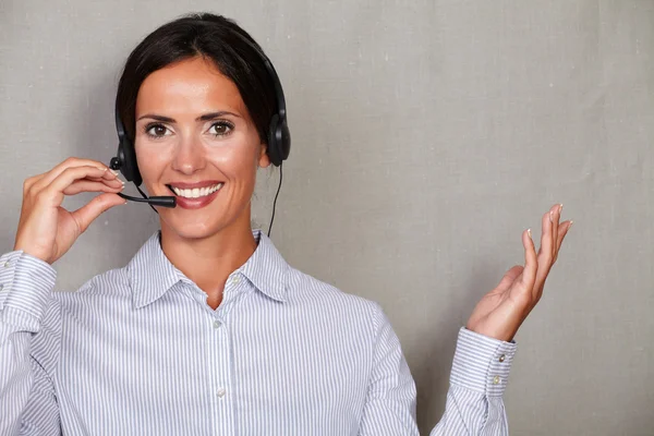 Lady secretary speaking through headset — Stock Photo, Image