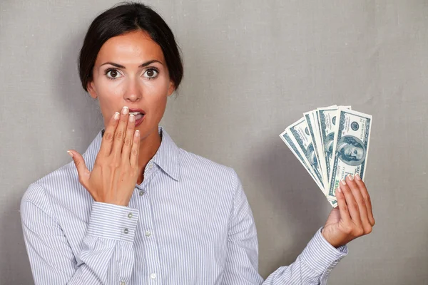 Surprised adult woman holding money — Stock Photo, Image