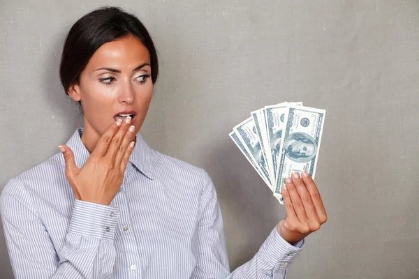 Young female holding dollars — Stock Photo, Image