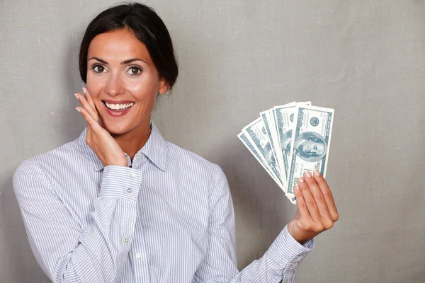 Young businesswoman holding money bills — Stock Photo, Image