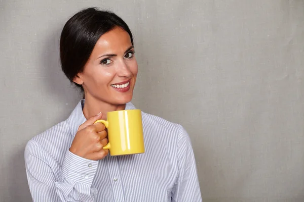 Happy young lady with hot drink — Stok fotoğraf