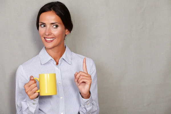 Business lady smiling and pointing up — Stok fotoğraf