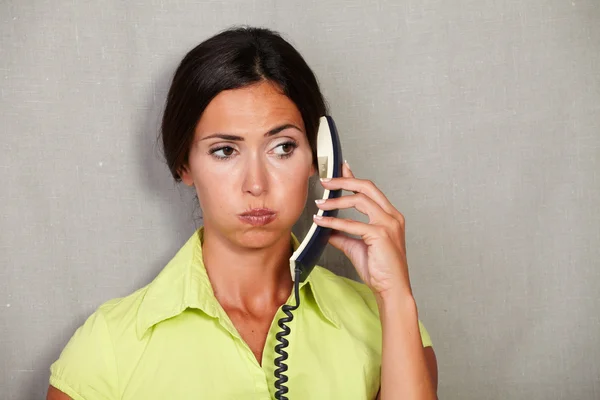 Tired customer service lady with phone — Stock Photo, Image