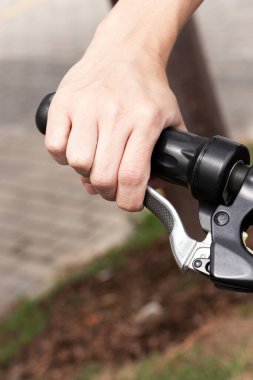 Man braking with his hand on electric bike