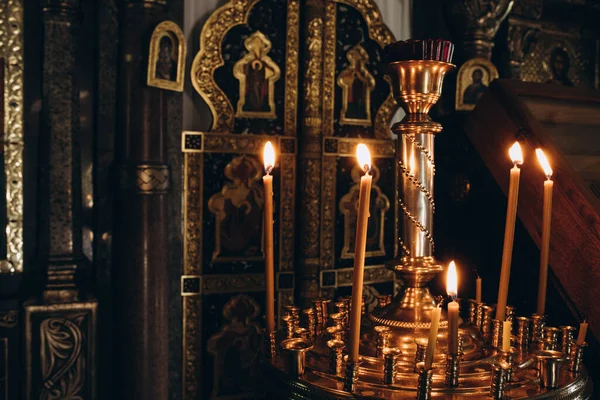 Candles on a candlestick in a church warm light — Stock Photo, Image