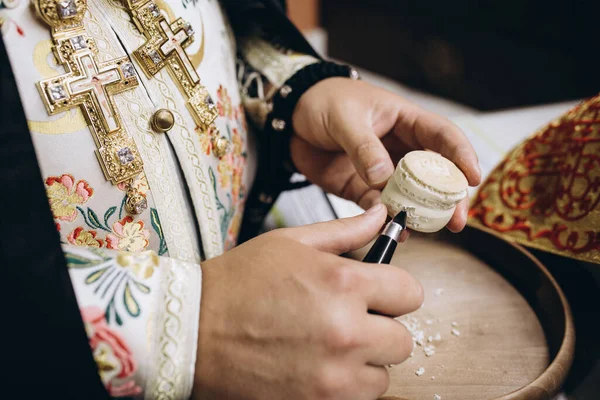 priests hands and bread and prayer