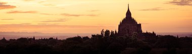 Panoramic landscape view of ancient temples silhouette at sunset