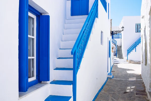 Typical traditional beautiful Greek street in white and blue sty